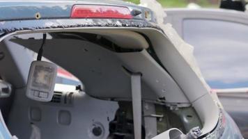 A car after an accident with a broken rear window. Broken window in a vehicle. The wreckage of the interior of a modern car after an accident, a detailed close-up view of the damaged car. video