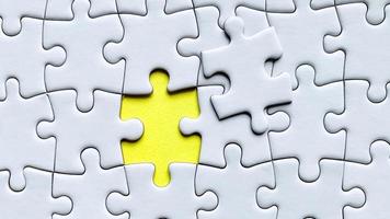 Jigsaw puzzle on yellow background with customizable space for text or ideas. Copy space photo