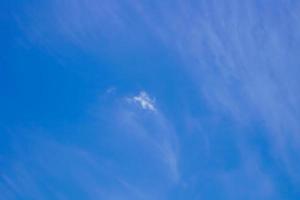 blue sky background with small clouds in panoramic view. photo