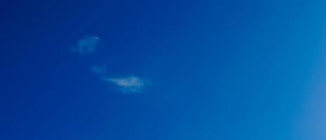 blue sky background with small clouds in panoramic view. photo