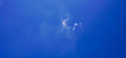 blue sky background with small clouds in panoramic view. photo