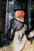scarecrow for halloween. Halloween holiday concept. Scarecrow with pumpkins. Thanksgiving Day. Evil scarecrow costume. selective focus photo