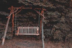 Garden swing in the forest photo