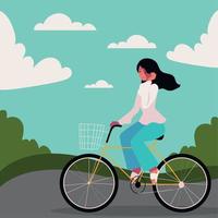 niña montando en bicicleta vector