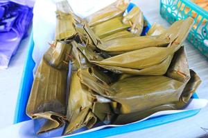 Pepes Tahu. Steamed cake of minced beancurd and spices in banana leaf parcel. photo