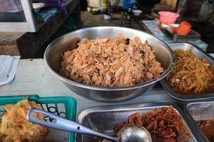 Traditional Food in a Restaurant aka Warteg or Warung Tegal. Traditional Culinary Menu of Indonesia. Indonesian Food in a Food Stall. Tasty Cuisine of Indonesia photo