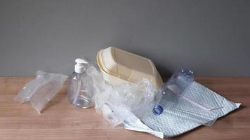household plastic waste - stop motion animation - heap of domestic plastic trash such as bottles bags containers and packaging material video