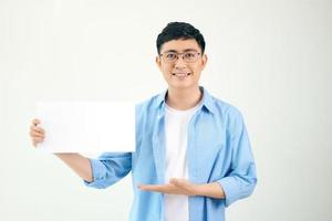 Young asian man holding poster photo