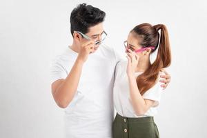 Cheerful happy family in glasses embracing and having vacation photo