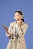 Woman listening to music in earbuds wireless headphones and rejoicing photo