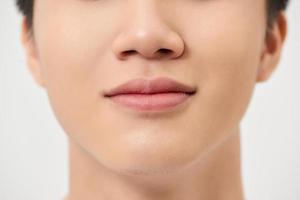 Close-up shot of a part of man's face. Isolated on white background photo