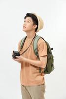 young handsome man tourist with  camera in hands isolated photo