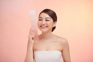 Beauty Skin care woman showing skin color paper, with clean face skin photo