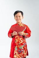 Happy lunar new year. little boy showing red envelope photo