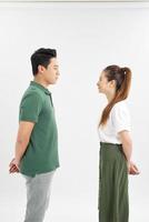 Young couple standing face to face photo
