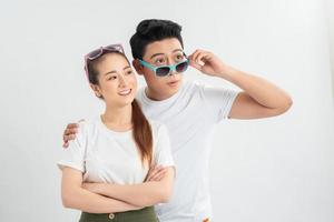 Shocked young friends or family couple dropping eyeglasses, feeling amazed head shot portrait photo