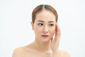 Portrait of tired and upset Asian woman over white background photo