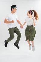 Full length shot of jumping couple having fun together. photo