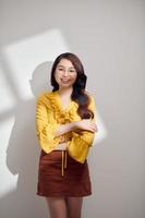 Young elegant woman in yellow top. Art portrait with shadows photo