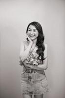 Beautiful sexy asian woman pose against studio background. Black-white photo. photo
