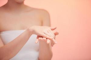 Beautiful women hands isolate, applying cream, massaging photo