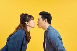 Profile side photo of charming spouses send air kiss isolated over vivid color background