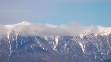 Thick clouds swirling over a mountain range slopes near Black Sea coast. Caucasus, Russia. Time lapse. video