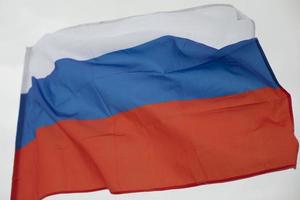 Flag of Russia. Fabric in wind. Official flag of Russian Federation. photo