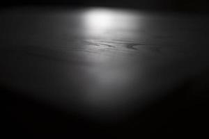 Wood in detail. Board is varnished. Surface of table in macro photography. Light on smooth surface. photo