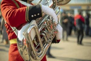 Orchestra with wind instruments. Trumpeters in ceremonial uniforms. photo