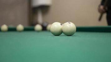 Billiard balls are white. Green billiard table. Playing in bar. Sports competition. photo