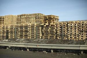 Warehouse of wooden pallets. Lots of boards. photo