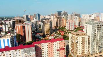 Aerial fly over new modern and old soviet type apartment neighborhoods in Batumi summer resort. Batum City development and property business concept video