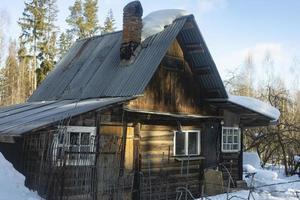 House in village. Old house made of wood. photo