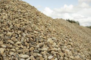 Crushed stone at construction site. Mound of stones. Building material. photo