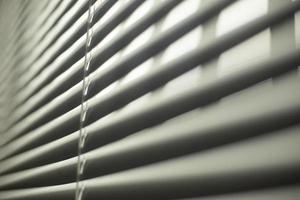 Blinds in house. Protection from light. Texture of blinds is entirely in frame. photo