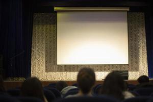 Auditorium. White screen for image projection. photo