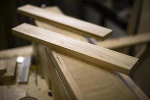 Carpenter makes wood. Board processing. photo