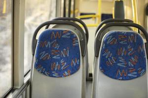 Seats on bus. Empty seats in transport. Seats for passengers. photo