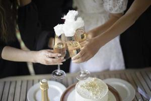 Girls hold glasses of wine. Party details. Wedding celebration. photo