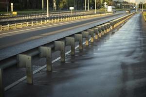 Washed road. Road bumper. Design to protect pedestrians. Fence for cars. Place of passage. Pedestrian area. photo