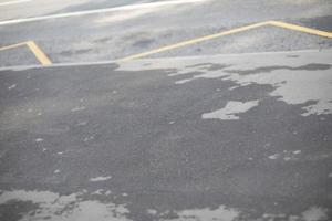 Asphalt on road. Road is wet. Roadway details. photo