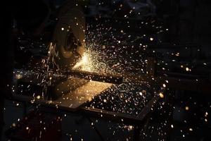 Sparks from metal. Lots of sparks from grinding steel. photo