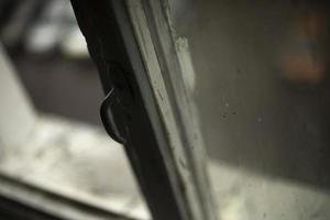 Old window. Wooden frame and glass. Interior details. photo