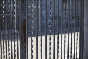 Fence on street. Just fence. Details of suburbs on territory. photo