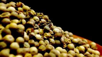 Concept K24 A Macro Video of White Pepper Pile with Black Background