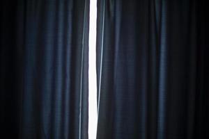 Blue curtains on window. Window in apartment. photo