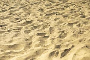 Yellow sand on beach. Texture of sand. Summer background. photo