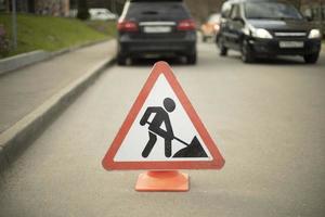 Road sign of road repair. Careful repair. Driver warning. photo