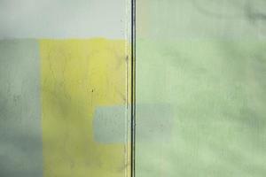 Painted wall. Different paint on surface of wall. photo